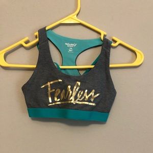 Grey, blue, and gold sports bra
